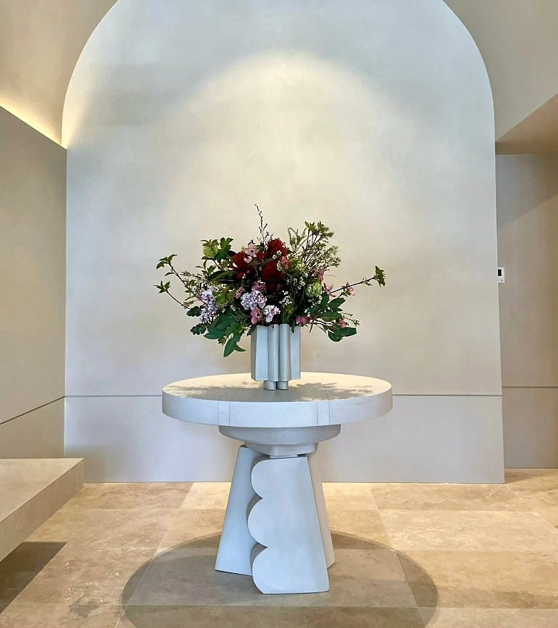 Sisu Flower seasonal subscription arrangement on a sculptural stone table